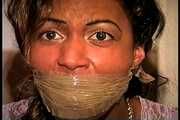 27 Yr OLD BEAUTY SALON OWNER HAS PANTY THONG STUFFED IN HER MOUTH, WRAP TAPE GAGGED, GAG TALKING, HANDGAGGED, BAREFOOT, TOE-TIED AND TIGHTLY HOG TIED ON THE BED (D74-12)