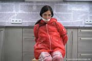 Miss Amira in red nylon rain gear and tranparent rain suit get´s bouind and gagged
