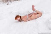 Naked barefoot Greta is tightly bound in snow - Photos