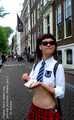 I’m cycling through Amsterdam in my mini school uniform