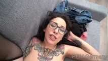 A hot milf with tattoos and glasses