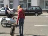 Katharina take a walk with her dog wearing a sexy red shiny down jacket (Video)