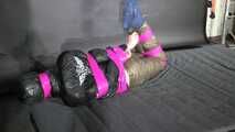 Marie M bound and gagged in shiny nylon Downwear trying to escape