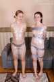 Bekki and Kelly - Sisters are taped and wrapped together face to face