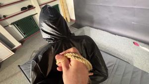 Marie M tightly bound and gagged in shiny nylon Rainwear