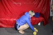 Watching sexy Sonja wearing a supersexy oldschool blue shiny nylon shorts and a lightblue rain jacket during her workout with barbells (Pics)