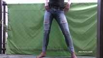 Desperation pee in jeans on balcony