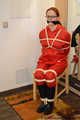 Bondage in  red nylon rainwear