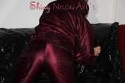 Watching Lucy wearing a supersexy purple/red downsuit preparing her sofa and lolling on it (Pics)