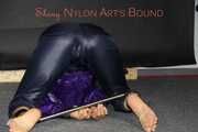 Watching Sandra wearing a sexy shiny nylon rain pants and a rain jacket ties and gagges herself with a bar and a cloth gag on the floor (Pics)