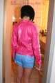 Watching a sexy archive girl wearing a hot lightblue shiny nylon shorts and a pink shiny nylon rainjacket doing her household (Pics)