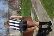 Watching Pia sweeping the terrace wearing a sexy black shiny nylon shorts, a striped top and black rubber boots (Pics)