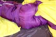 Lucy wearing a supersexy purple rain suit with hood while preparing her bed (Pics)