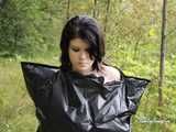 [From archive] Stella is walking in the forest in trash bag dress