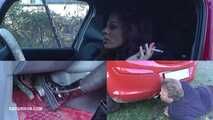 Mistress Cleo steps on the gas pedal and smokes Picture in picture