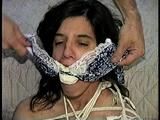 26 Yr OLD K-MART CLERK IS RING-GAGGED, BALL-TIED, IS RING GAGGED, MOUTH STUFFED, BIKINI TOP GAGGED, BALL-GAGGED, ACE BANDAGE GAGGED, BLINDFOLDED, TOE-TIED & DROOLING WHILE SITTING BALL-TIED AND NAKED ON THE FLOOR (D65-2)