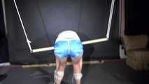 Watching sexy Sonja wearing a sexy blue shorts and a white top being tied and gagged overhead (Video)