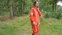 Miss Petra takes a walk in a orange AGU rain suit and rubber boots