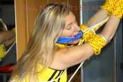 ***HOT HOT HOT***Sandra wearing supersexy blue/yellow shiny nylon shorts and a yellow top tied and gagged over head with ropes and cloth gag (Pics)