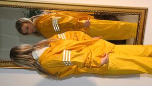 Get 450 Pictures of Monika enjoying shiny nylon Rainwear from 2008-2012!