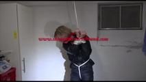 Pia tied, gagged and hooded in a cellar overhead wearing shiny nylon rainwear in black (Video)