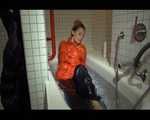 SEXY SANDRA wearing an special orange down jacket and a black down pants during taking a bath playing with water and the downwear (Video)