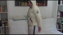 Jill tied by using cable ties, gagged and hooded on a white sofa wearing a sexy white rain pants and a white moncler down jacket (Video)
