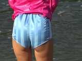 Watch Chloe enjoying her shiny nylon Shorts outside at a sunny Day