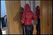 Lucy wearing a sexy very thin adidas rain pants and a red shiny down jacket posing infront of the mirror (Video)