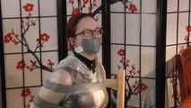 Lady Nadja is bound and gagged in a nice PVC dress and a transparent raincoat trying to escape