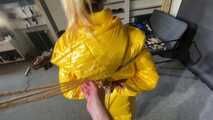 Ms Ungeniert tied, gagged and hooded in shiny nylon yellow Downjacket