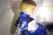 Sonja wearing a super sexy shiny nylon rain jacket and rain pants while taking a foam bath (Pics)