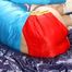 Pia tied and gagged on a bed wearing a shiny red nylon shorts and a blue rain jacket (Pics)