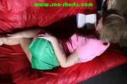 Sexy PIA wearing a sexy green shiny nylon shorts and a tshirt lolling on the sofa reading a book (Pics)