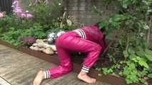 Watching Aiyana wearing supersexy pink shiny nylon rainwear while planting flowers in the garden (Video)