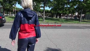 Watching sexy Sonja wearing sexy shiny nylon rainwear walking around the pedestrian area (Video)