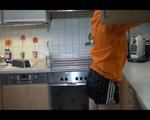 Sonja cleaning up the kitchen wearing a sexy black shiny nylon shorts and an orange rain jacket (Video)