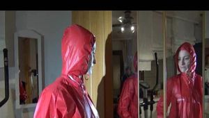 Watch Sonja to dress herself with rainwear and begin her workout on the home trainer (Video)
