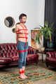 Topless and barefoot Claudia hogtied within red ropes - Photos