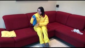 Jill ties, gagges and hoodes herself wearing a shiny yellow down jacket and a yellow rain pants(Video)