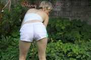 Watching sexy Sonja wearing white shiny nylon shorts and a top during watering the garden (Pisc)