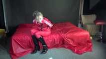 ***HOT***HOT***HOT***Mia wearing a sexy red shiny nylon jumpsuit and black shiny heel rubber boots being tied and gagged with belts and a clothgag (Video)