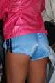 Watching a sexy archive girl wearing a hot lightblue shiny nylon shorts and a pink shiny nylon rainjacket doing her household (Pics)