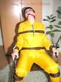 Jill tied, gagged and hooded with a tension belt on a chair wearing a supersexy yellow shiny nylon rainpants and rain jacket (Pics)