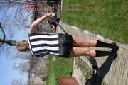 Watching Pia sweeping the terrace wearing a sexy black shiny nylon shorts, a striped top and black rubber boots (Pics)