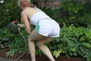 Watching sexy Sonja wearing white shiny nylon shorts and a top during watering the garden (Pisc)