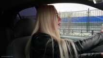 Ekaterina is smoking while driving her car