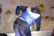 Watching Sonja taking a foam bath  wearing sexy blue shiny nylon rainwear (Pics)