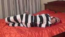 Morrigan - Redhead plays the role of a submissive girl in a prison uniform (video)