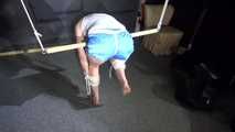 Watching sexy Sonja wearing a sexy blue shorts and a white top being tied and gagged overhead (Video)